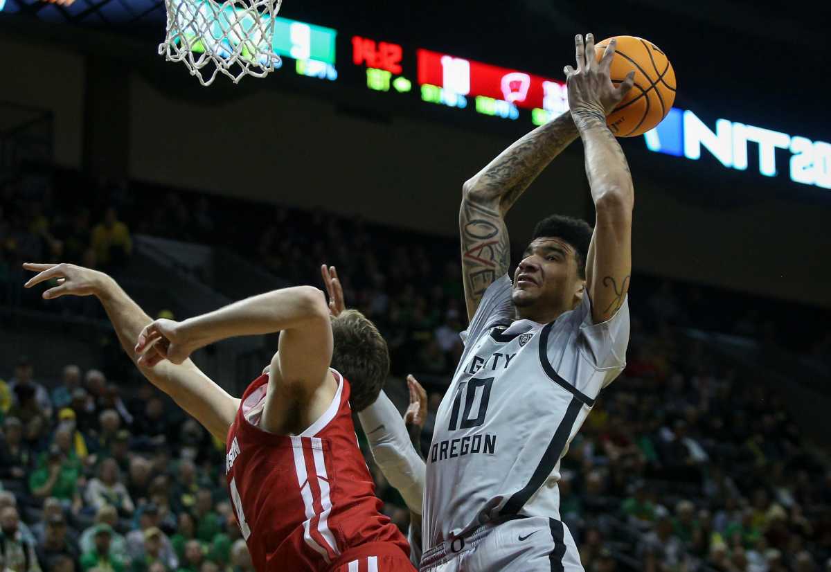 Oregon center Kel'el Ware drags down a rebound as the Oregon Ducks host Wisconsin in the quarterfinal round of the NIT Tuesday, March 21, 2023 at Matthew Knight Arena in Eugene, Ore.